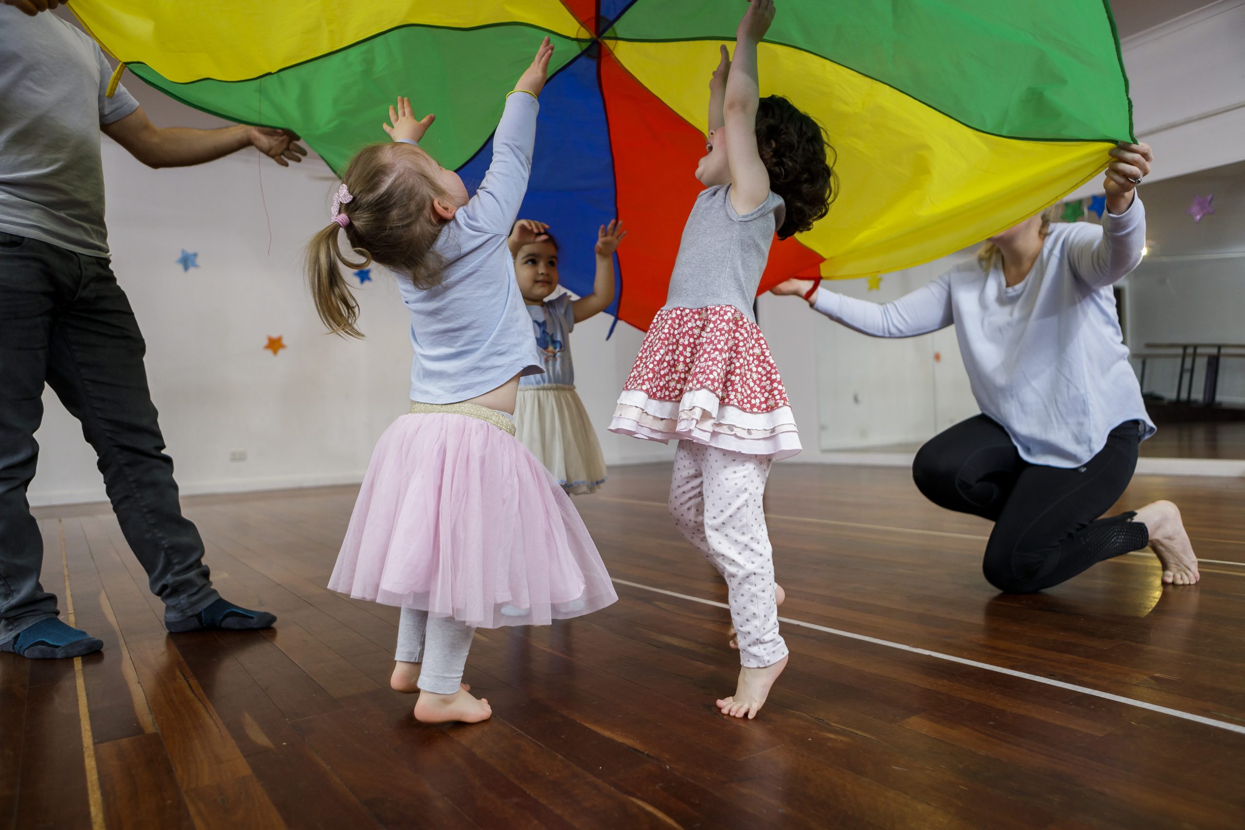 Parent and child dancing together